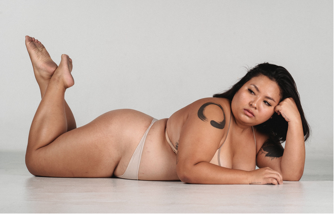 an obese woman lying down